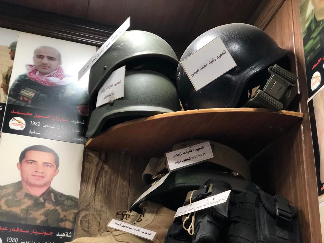 Helmets of Peshmerga who died defending the Kurdistan Region on display in Duhok coffee shop (Photo: Kurmanj Nhili)